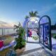 Suasana Romantic Ocean Dome Dinner di HARRIS Resort Waterfront Batam saat sunset.